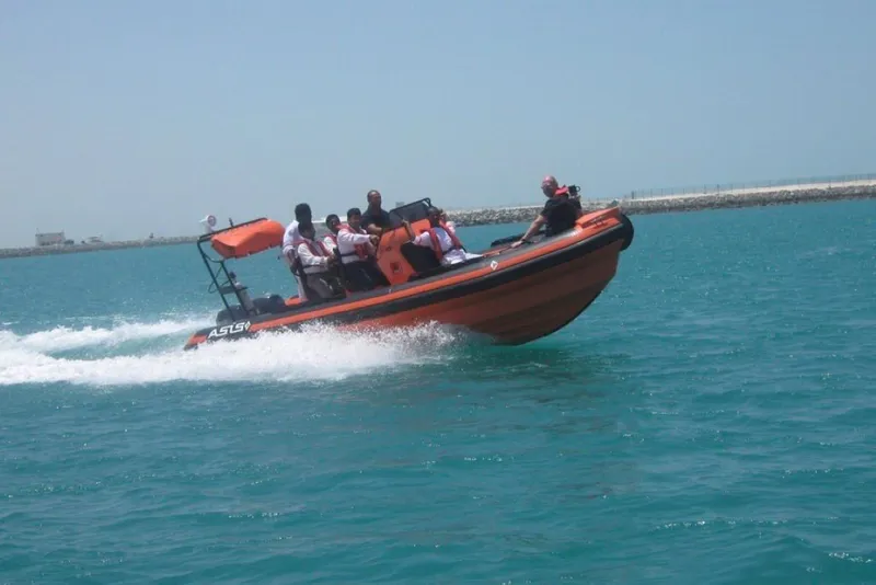Slide: The Image of 2022 Ocean Craft Marine Solas Rescue 6.5M boat speeding on water with passengers. - 6