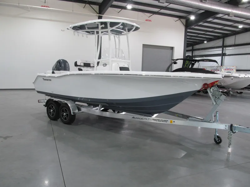 The Image of 2022 Tidewater 210 LXF boat on trailer in indoor showroom. - 1