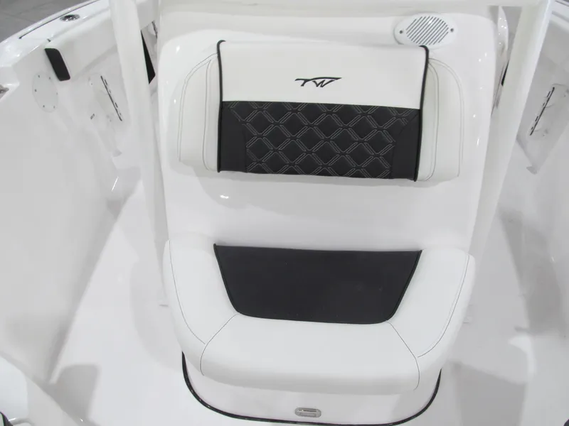 Slide: The Image of 2022 Tidewater 210 LXF boat seat with black and white upholstery. - 11