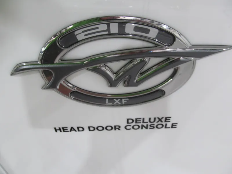 Slide: The Image of Tidewater 210 LXF 2022 emblem with "Deluxe Head Door Console" text. - 13