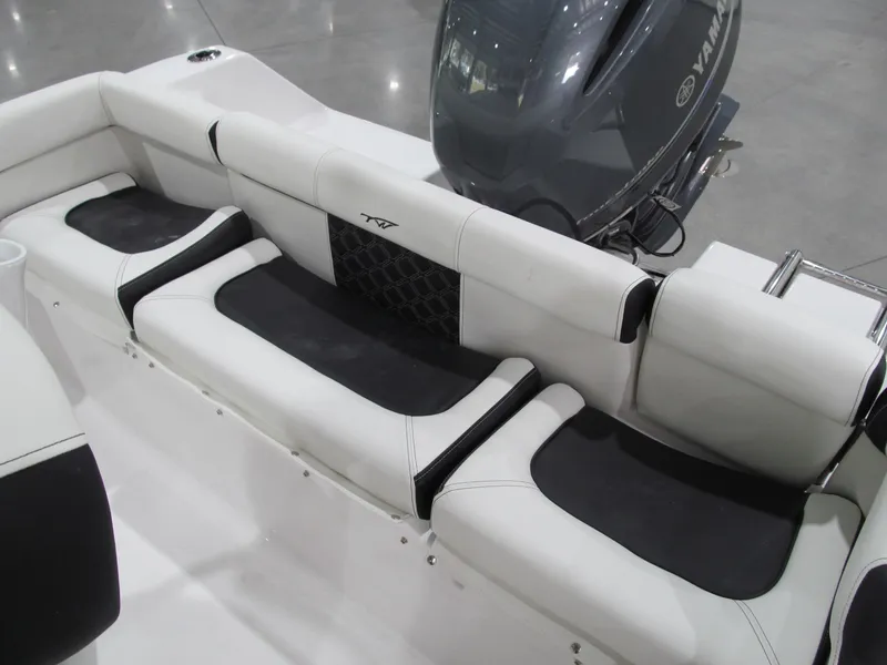 Slide: The Image of 2022 Tidewater 210 LXF boat interior with Yamaha engine, featuring sleek seating design. - 4