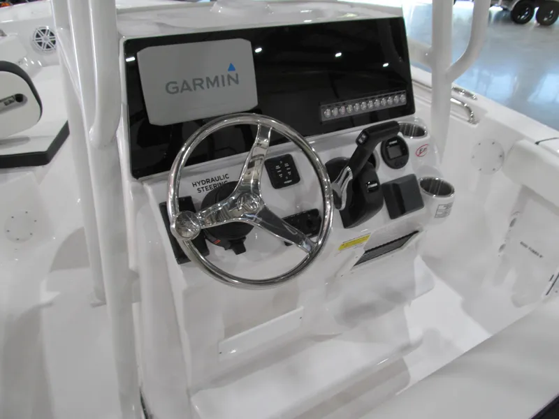 Slide: The Image of 2022 Tidewater 210 LXF boat console with Garmin navigation and hydraulic steering. - 6
