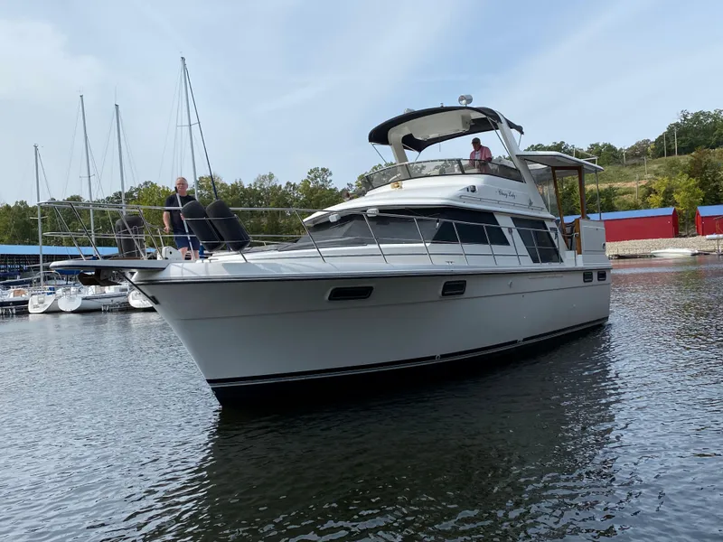 Slide: The Image of 1986 Carver 4207MY yacht docked in a marina. - 23