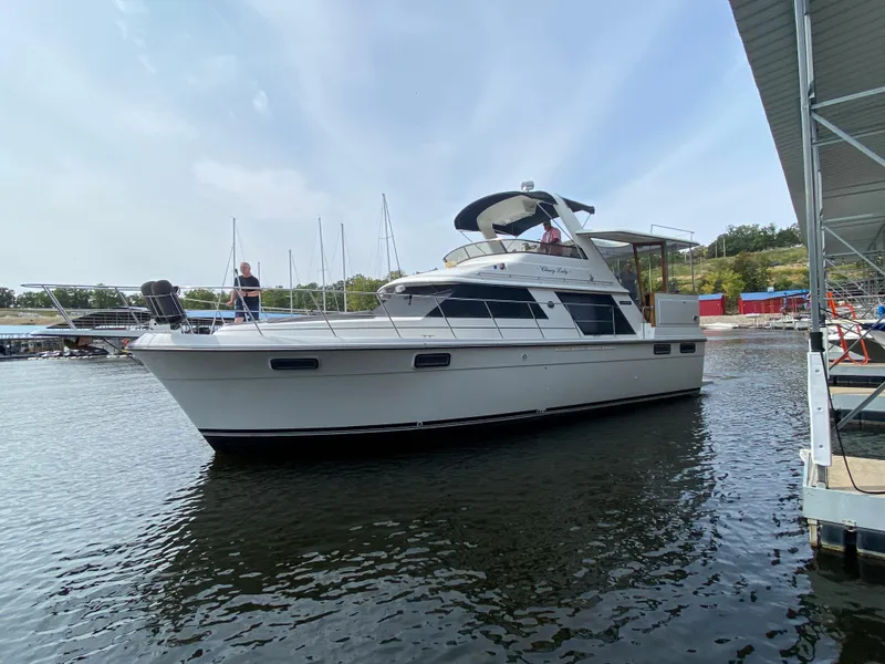 Slide: The Image of 1986 Carver 4207MY yacht docked in a marina. - 24