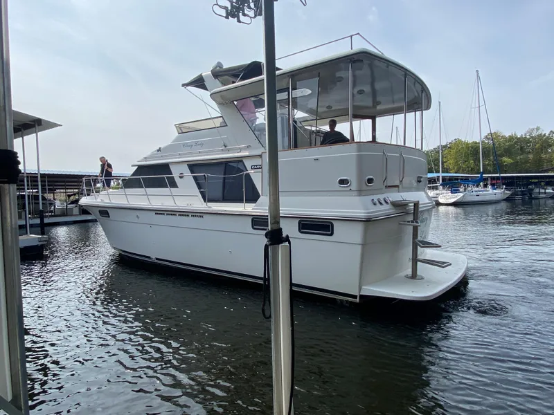 Slide: The Image of 1986 Carver 4207MY yacht docked in a marina. - 27