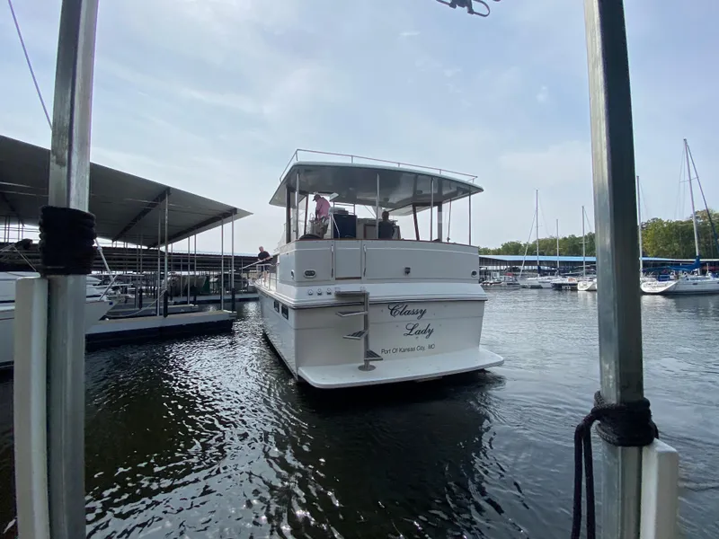 Slide: The Image of 1986 Carver 4207MY yacht Classy Lady docked at a marina. - 30