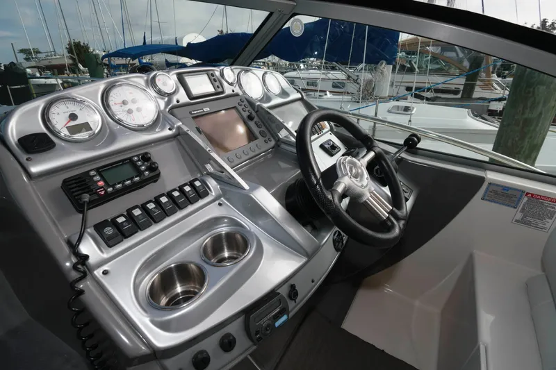 Slide: The Image of 2009 Monterey 340 Sport Yacht helm with modern controls and navigation equipment. - 8