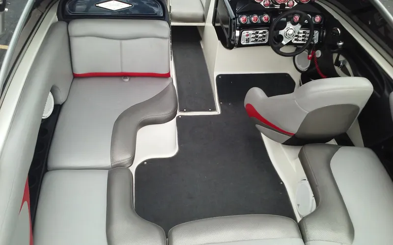 Slide: The Image of Interior of a 2006 MasterCraft X-Star SS boat with gray and red seating. - 10