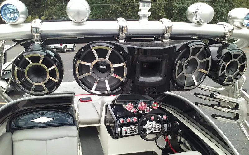 Slide: The Image of 2006 MasterCraft X-Star SS boat interior with advanced audio system and control panel. - 11
