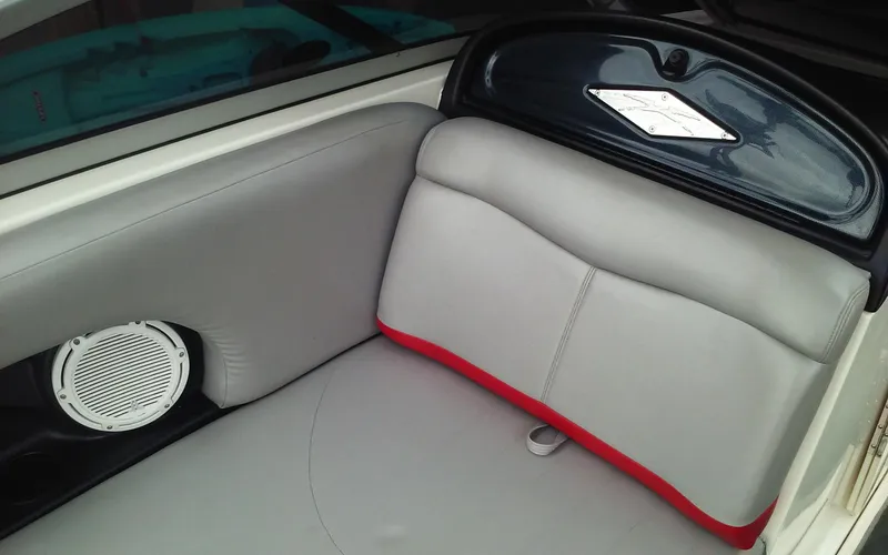 Slide: The Image of 2006 MasterCraft X-Star SS boat interior with gray and red seating. - 13