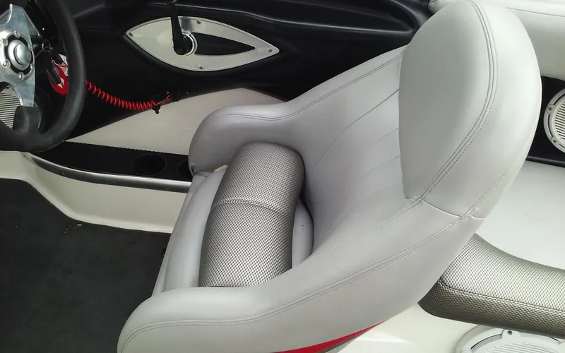 Slide: The Image of 2006 MasterCraft X-Star SS boat interior with grey captain's seat and steering wheel. - 15