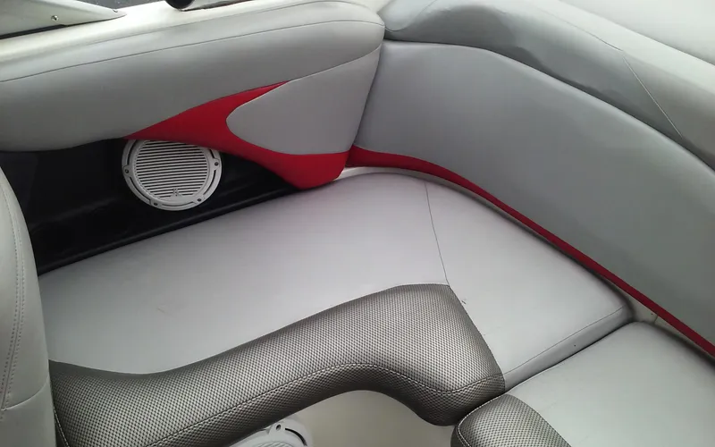 Slide: The Image of 2006 MasterCraft X-Star SS boat interior with gray and red upholstery. - 16