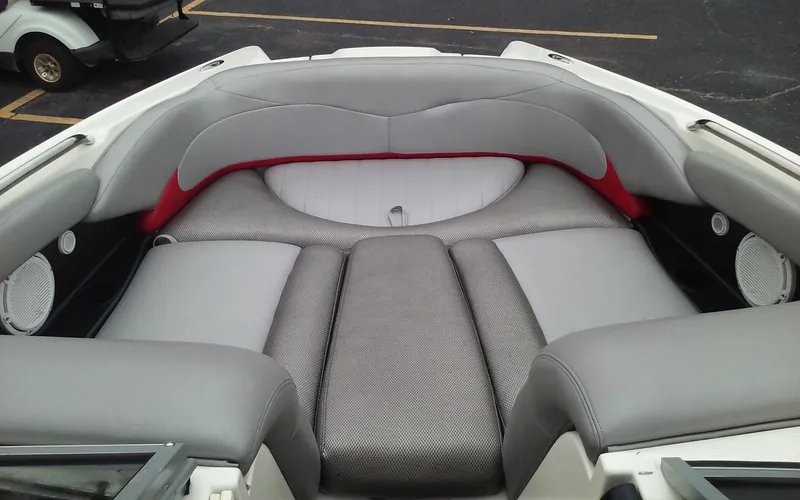 Slide: The Image of 2006 MasterCraft X-Star SS boat interior with gray and red seating. - 19