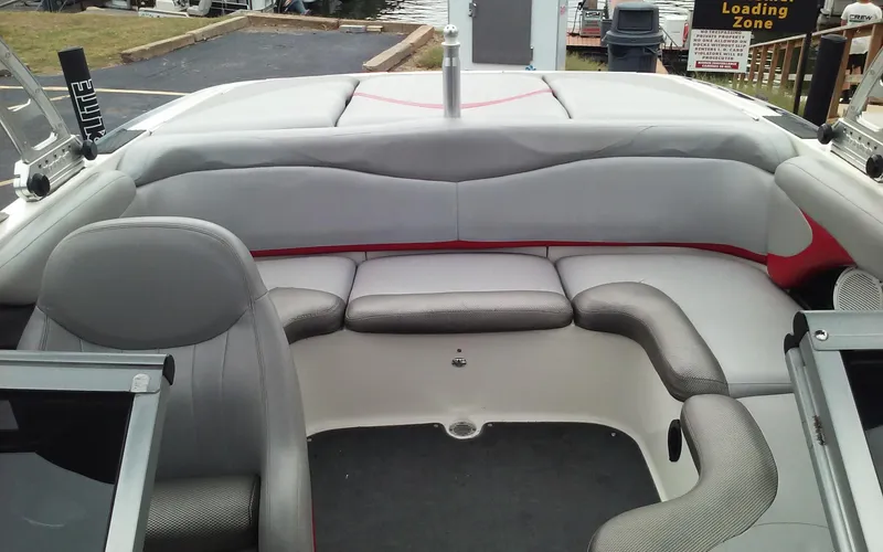Slide: The Image of 2006 MasterCraft X-Star SS boat interior with gray and red seating. - 21
