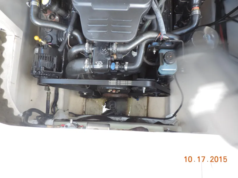 Slide: The Image of Engine compartment of a 2003 Sea Ray Bow Rider boat, showing detailed mechanical components. - 6