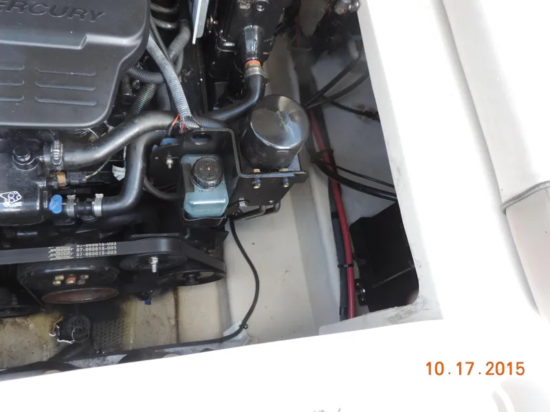 Slide: The Image of 2003 Sea Ray Bow Rider engine compartment with visible Mercury engine components. - 7