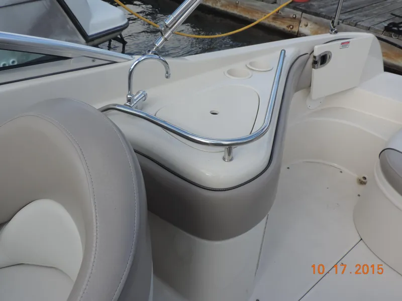 Slide: The Image of 2003 Sea Ray Bow Rider interior with seating and cup holders. - 8
