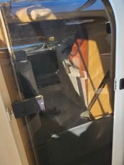 Slide: The Image of 2006 Rinker 300 Express Cruiser cabin interior with seating and storage. - 11