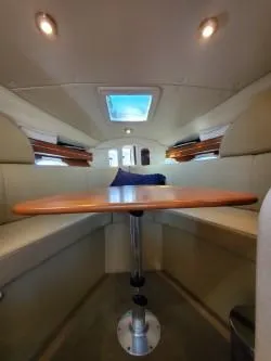 Slide: The Image of Interior of 2006 Rinker 300 Express Cruiser with seating and table. - 16