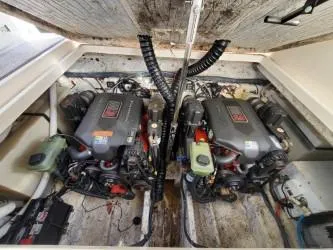 Slide: The Image of Engine compartment of a 2006 Rinker 300 Express Cruiser with dual engines. - 22