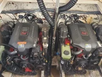 Slide: The Image of Twin engines of a 2006 Rinker 300 Express Cruiser boat. - 23