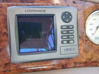 Slide: The Image of Lowrance HDS5 marine GPS on 2006 Rinker 300 Express Cruiser dashboard. - 3
