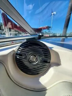 Slide: The Image of 2006 Rinker 300 Express Cruiser speaker and dashboard with marina background. - 8
