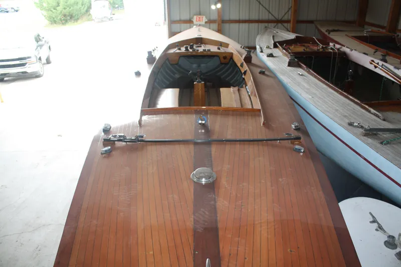 Slide: The Image of 1934 Custom Northern Michigan NM wooden boat in storage. - 14