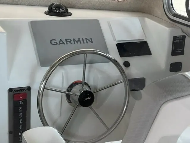 Slide: The Image of 2024 Parker 2520 XLD Sport Cabin helm with Garmin navigation system. - 13
