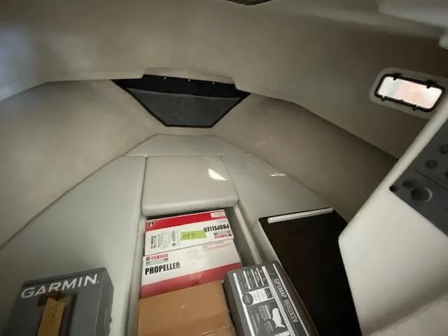 Slide: The Image of 2024 Parker 2520 XLD Sport Cabin interior with storage boxes and equipment. - 5