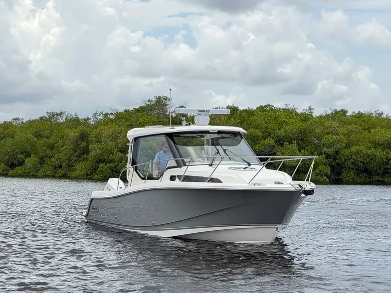 Slide: The Image of Boston Whaler 325 Conquest 2027 - 30