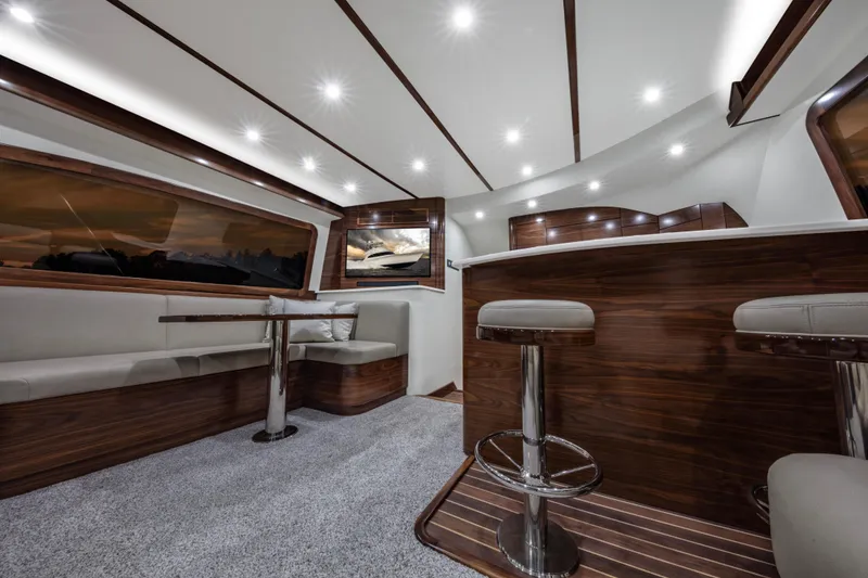 Slide: The Image of Luxurious interior of the 2024 Albemarle Spencer Edition yacht with modern seating and lighting. - 14