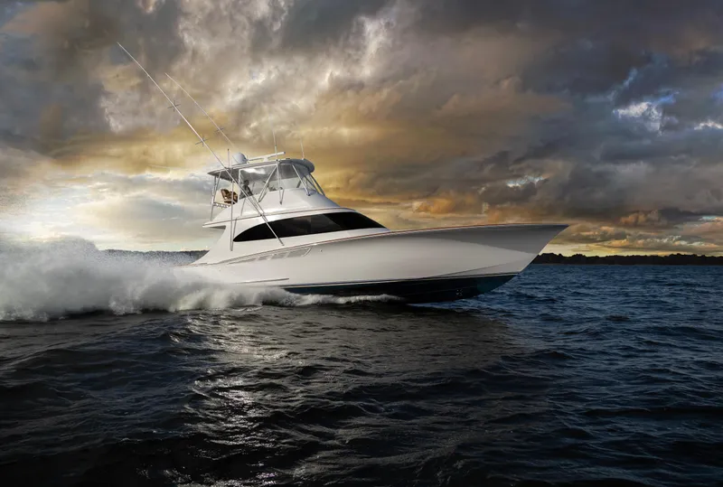 Slide: The Image of 2024 Albemarle Spencer Edition boat cruising on water at sunset. - 4