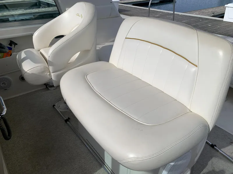 Slide: The Image of 2001 Sea Ray 310 Sundancer interior with white leather seating. - 21