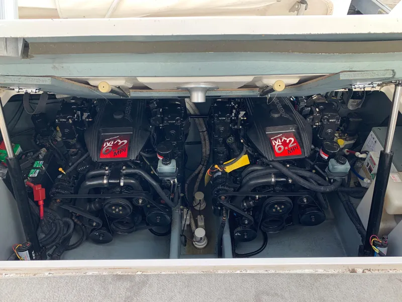 Slide: The Image of Engine compartment of 2001 Sea Ray 310 Sundancer with twin engines visible. - 25