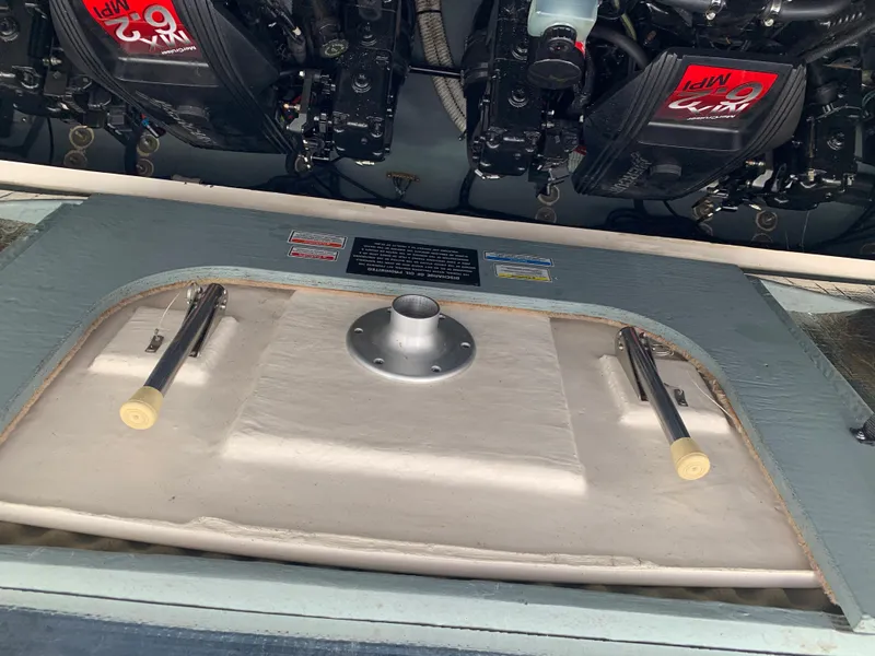 Slide: The Image of Engine compartment of 2001 Sea Ray 310 Sundancer with visible components. - 29