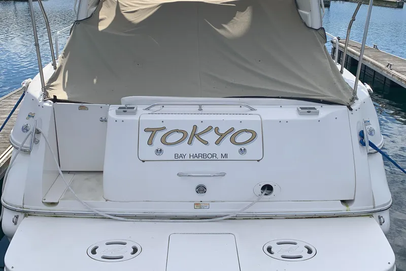 Slide: The Image of 2001 Sea Ray 310 Sundancer docked, featuring "Tokyo" nameplate, Bay Harbor, MI. - 32