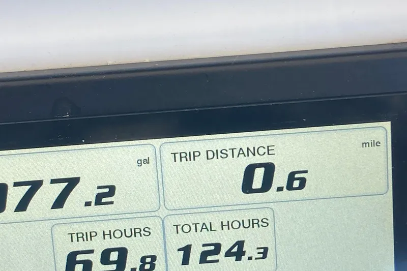 Slide: The Image of Boat dashboard display showing trip distance, fuel usage, and hours for 2022 Regulator 26XO. - 6