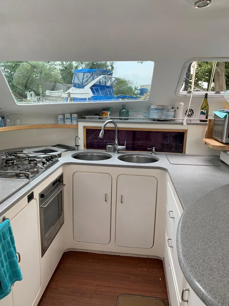 Slide: The Image of 1996 Voyage Yachts 470 kitchen with dual sinks and modern appliances. - 11