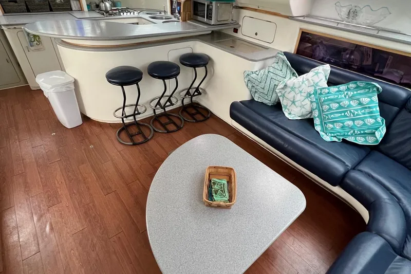 Slide: The Image of Interior of 1996 Voyage Yachts 470 with modern kitchen and cozy seating area. - 20