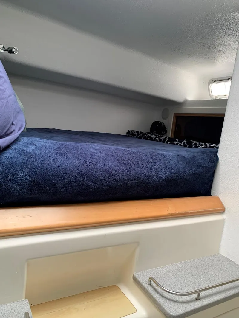 Slide: The Image of Cozy cabin bed in 1996 Voyage Yachts 470 sailboat. - 31