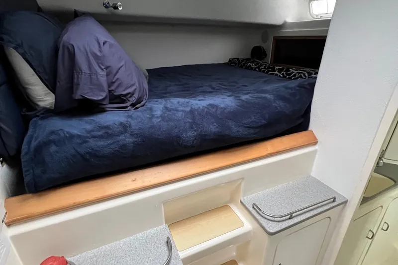 Slide: The Image of Cozy cabin bed in a 1996 Voyage Yachts 470 sailboat. - 34