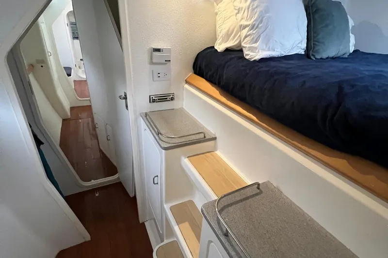 Slide: The Image of Interior cabin of a 1996 Voyage Yachts 470 with bed and storage compartments. - 39