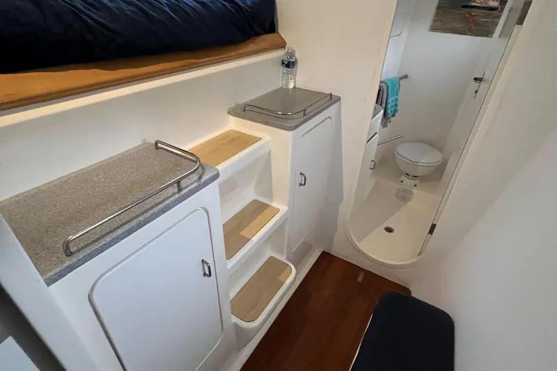 Slide: The Image of Interior of 1996 Voyage Yachts 470 with steps, storage, and bathroom. - 40