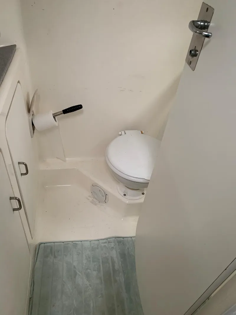 Slide: The Image of 1996 Voyage Yachts 470 bathroom with toilet and storage cabinet. - 41