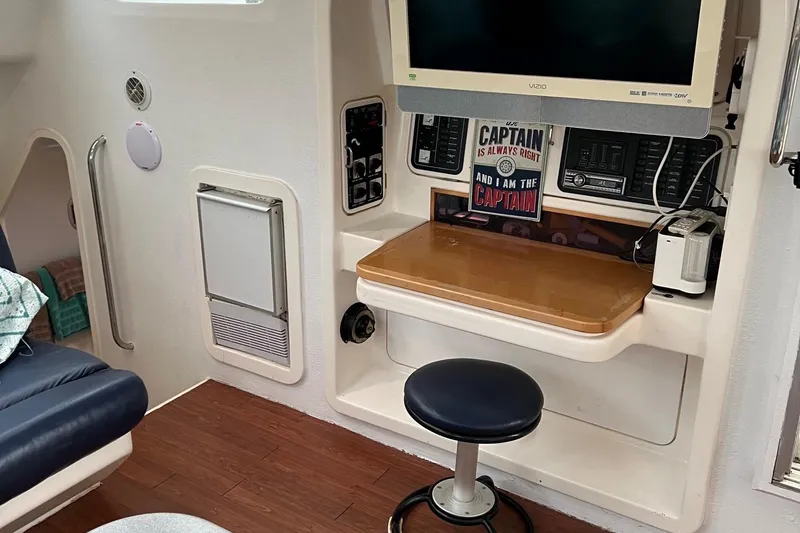 Slide: The Image of Interior of 1996 Voyage Yachts 470 with navigation station and seating. - 8
