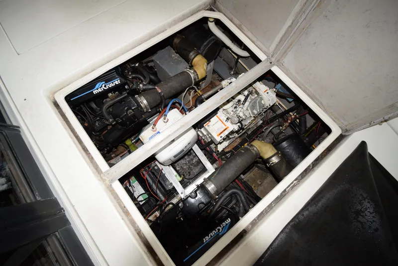 Slide: The Image of Engine compartment of a 1989 Carver 32 Mariner boat, showcasing mechanical components. - 31