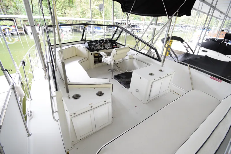 Slide: The Image of 1989 Carver 32 Mariner boat interior with seating, helm, and canopy. - 6