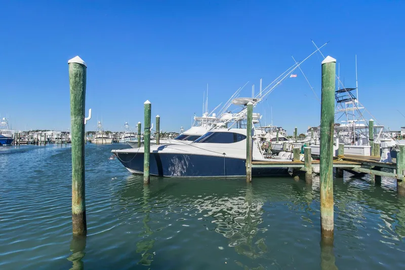 Slide: The Image of 2017 Jupiter 41SB boat docked at a marina on a sunny day. - 1
