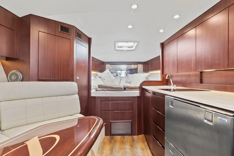 Slide: The Image of 2017 Jupiter 41SB yacht interior with modern kitchen and cozy sleeping area. - 11